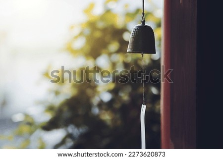 Japanese wind chime and green blur background