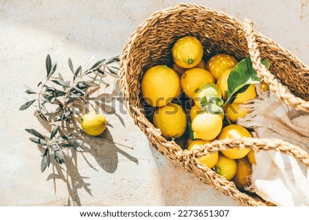 Fresh lemons in the basket.  Royalty-Free Stock Photo #2273651307