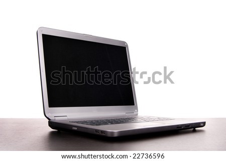 grey laptop at desk isolated on white background