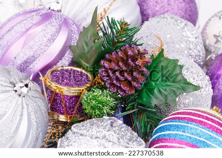 Christmas decoration with balls, cone, gift box closeup picture.