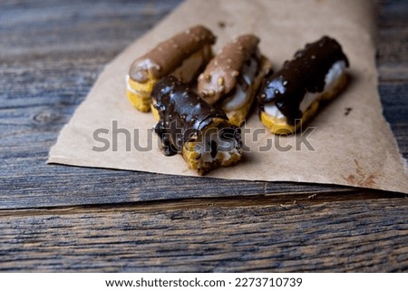 Chocolate eclairs, traditional French dessert, close-up.