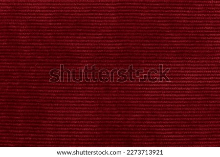 Texture of purple fabric in red color with small straight lines