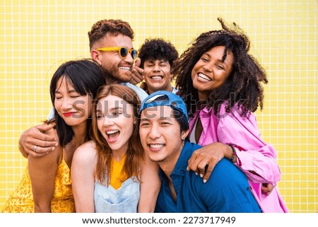 Multiethnic group of happy friends bonding and having fun at the beach on summer vacation - Multiracial real authentic people spending time together at the sea, concepts about youth and summertime Royalty-Free Stock Photo #2273717949