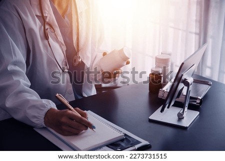 Male Doctor writing out RX prescription, copy space, consent contract sign prescribe a remedy healthy lifestyle healthcare Online medical service concept Royalty-Free Stock Photo #2273731515
