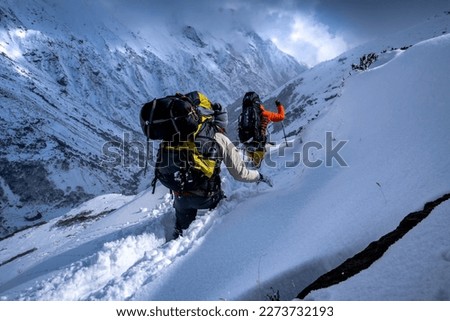 Mount Everest Base Camp Trek. After two meters of new snow 2 ski climbers Royalty-Free Stock Photo #2273732193
