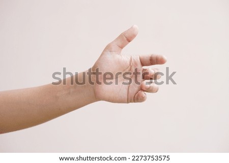 Asian woman making hands like holding an empty bottle