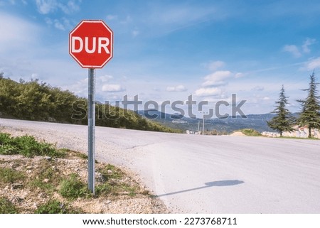 Stop road sign in Turkish, asphalt road landscape