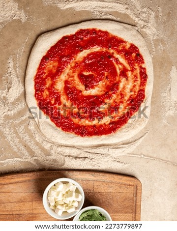Photography of the order of making a homemade pizza with fresh ingredients of it. 