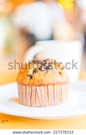 Chocolate muffin in coffee shop - vintage style effect pictures