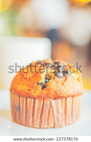 Chocolate muffin in coffee shop - vintage style effect pictures