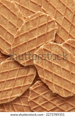 waffles, crunchy cookies snacks in full frame, sweet delicious wafer food background texture, close-up view taken straight from above Royalty-Free Stock Photo #2273789351