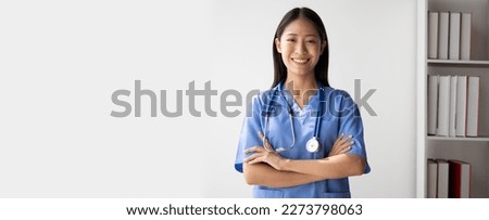 Portrait of female asian doctor standing in her office at clinic. Royalty-Free Stock Photo #2273798063