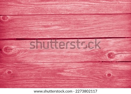 Viva Magenta trendy color of the year 2323.. old gray wooden planks