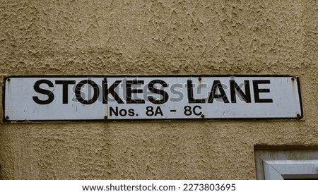 A street sign in the city of Plymouth called Stokes lane