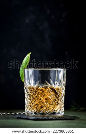 White negroni cocktail with dry gin, white vermouth and herbal aperitif. Dark background Royalty-Free Stock Photo #2273803851