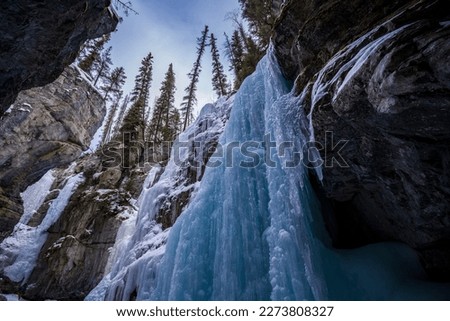 view of frozen waterfall with blue ice inside maligne canyon Royalty-Free Stock Photo #2273808327