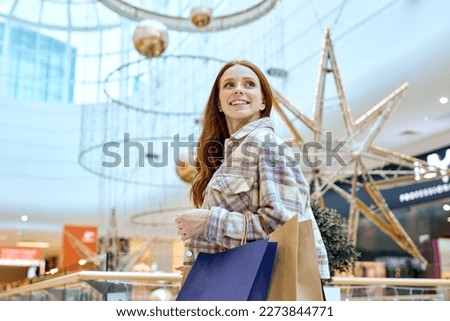 unexplainable joy, pleasure, and excitement.magical and therapeutic pastime, smiling girl with handbags looking up, low view.therapy Royalty-Free Stock Photo #2273844771