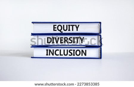 Diversity equity inclusion symbol. Concept words 'Diversity equity inclusion' on books on beautiful white background. Diversity, business, inclusion and equity concept.