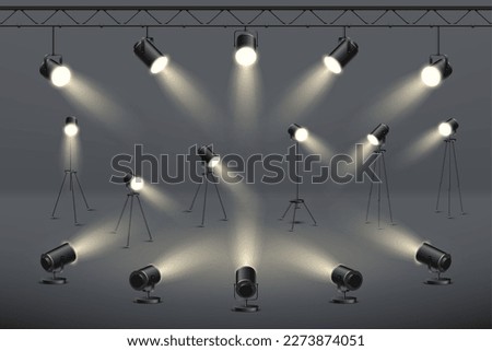 Studio light, stage spotlights, 3d lamps. Concert or movie equipment, photo spot lights hanging and standing, realistic video scene effect, projector illumination. Vector illustration design Royalty-Free Stock Photo #2273874051