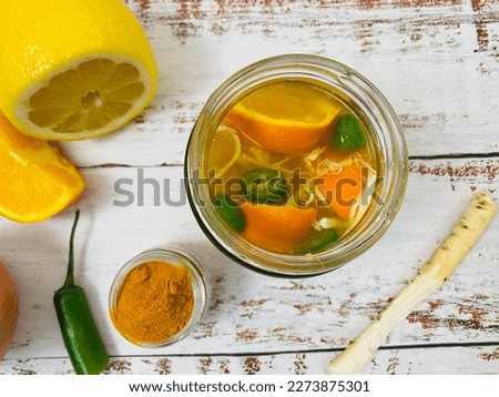 Top view of fire cider made at home to help build a robust immune system Royalty-Free Stock Photo #2273875301