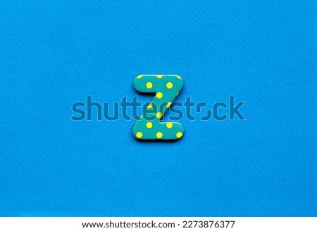 letter z on blue paper background 
