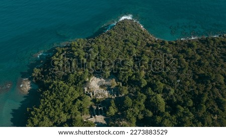 seaside beach with view from the top. Sunny day Resort area forest and blue sea