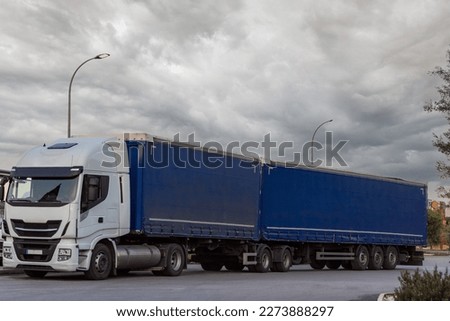 Mega truck or duo trailer, a set of a truck with two semi-trailers. Royalty-Free Stock Photo #2273888297