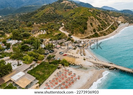 Aerial view of Bunec Beach area with concrete pier in Summer 2022, Albania