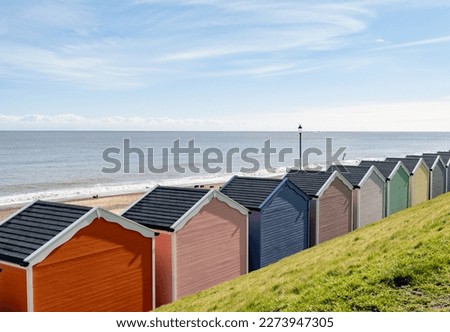 Colourful beach huts on the promenade or esplanade in the seaside town of Gorleston on the Norfolk coast Royalty-Free Stock Photo #2273947305