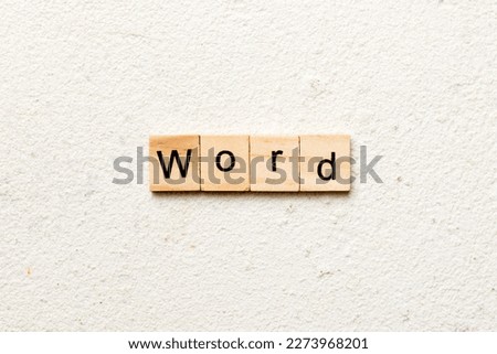 word written on wood block. WORD text on cement table for your desing, concept.