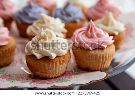 Closeup of colorful cupcakes for Birthday party, ready to eat homemade mini cakes - Image