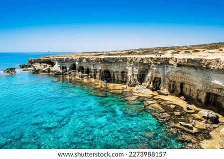 Sea caves near Ayia Napa in Cyprus. Natural rock formation famouse for cliff jumping into clear water. Dramatic coastline between Agia Napa and Cavo Greco National park Royalty-Free Stock Photo #2273988157