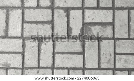 Background of pavement arrangement getting dry after rain in fron of the house
