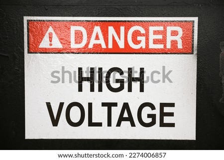 High voltage danger sign on wall for caution and security symbolizing warning dangerous zone