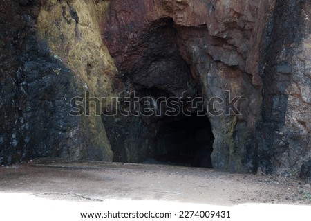 photograph of the entrance of a beautiful cave