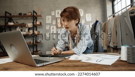 Asia people SME owner or retail fabric craft store work in artist studio home office on desk busy learn online study art class on laptop in digital dress color screen app write job idea skill on web.