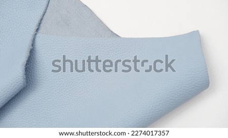 leather. cow-hide. Close up photo of sky blue cow skin. background