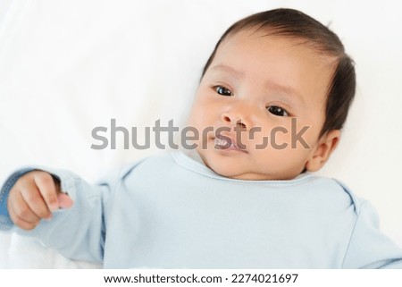 close up newborn baby is playing saliva Royalty-Free Stock Photo #2274021697
