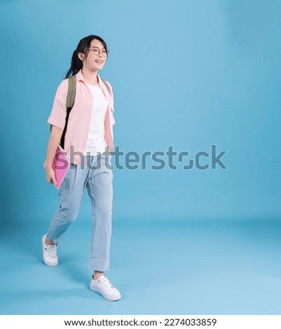 Asian school girl on blue background