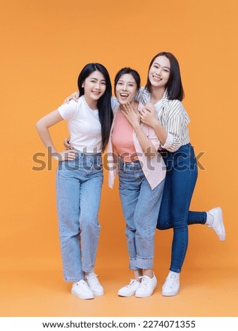 Image of young three Asian girl on background Royalty-Free Stock Photo #2274071355