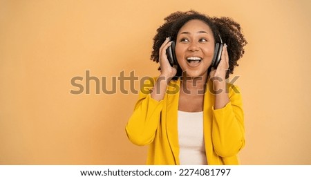 Portrait of beautiful  successful business African black girl in yellow suit celebrate with smartphone copy space on white background. Success and happy woman internet technology startup business. 