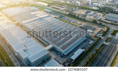 Top view Solar Panels on Warehouse Factory. Solar photo voltaic panels system power or Solar Cell on industrial building roof for producing green ecological electricity. Production of renewable energy Royalty-Free Stock Photo #2274085107