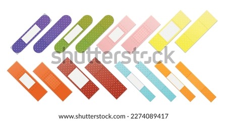 Realistic medical bandages set of isolated images with polka dot plaster band aid of different color vector illustration Royalty-Free Stock Photo #2274089417