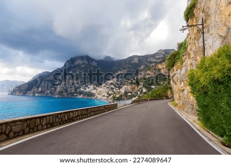 Scenic Road on Rocky Cliffs and Mountain Landscape by the Tyrrhenian Sea. Amalfi Coast, Positano, Italy. Adventure Travel Royalty-Free Stock Photo #2274089647