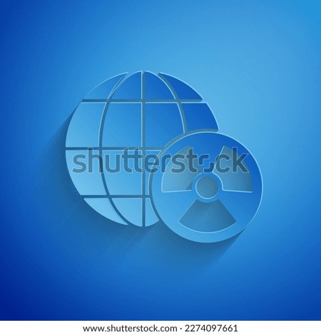 Paper cut Planet earth and radiation symbol icon isolated on blue background. Environmental concept. Paper art style. Vector