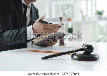 The concept of legal services of the Labor Law Consulting Office. lawyer working at desk Hammer and scales on lawyer table for justice