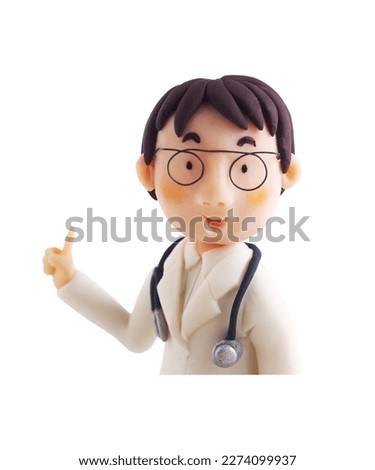 Upper half of the doctor explaining(This is a photo of a clay work)