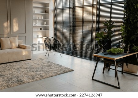 Beautiful living room. A modern, stylish and bright living room. Modern living room with kitchen. Stylish apartment interior with modern kitchen. Idea for home design. Designer house. Cozy apartment. Royalty-Free Stock Photo #2274126947