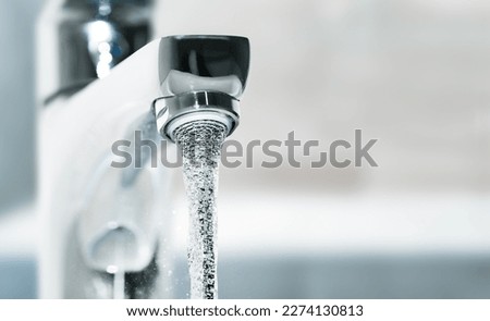 chrome faucet with high pressure water jet Royalty-Free Stock Photo #2274130813