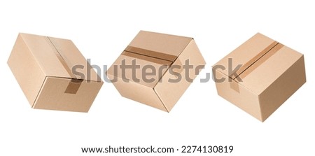 three levitating closed cardboard boxes from different angles on an isolated white background Royalty-Free Stock Photo #2274130819